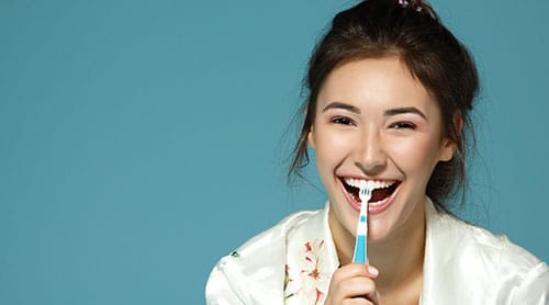 Woman brushing her teeth