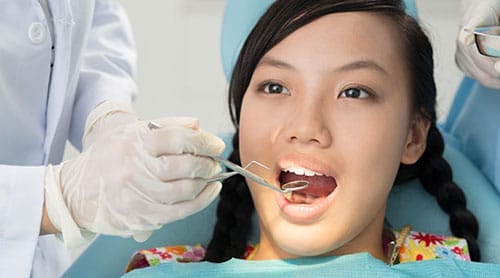 Patient gettng their teeth checked-out