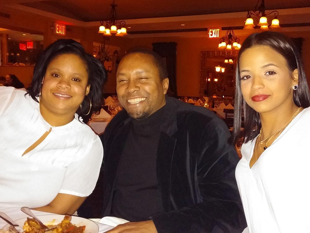 Staff smiling at table