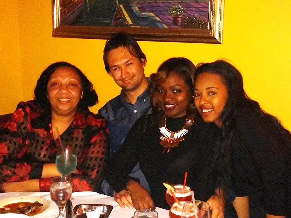 Staff smiling at table